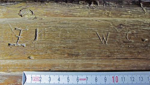 Ipplepen 6. Rood Screen. Crossed I (possible Christogram) on left; probable initials on right.