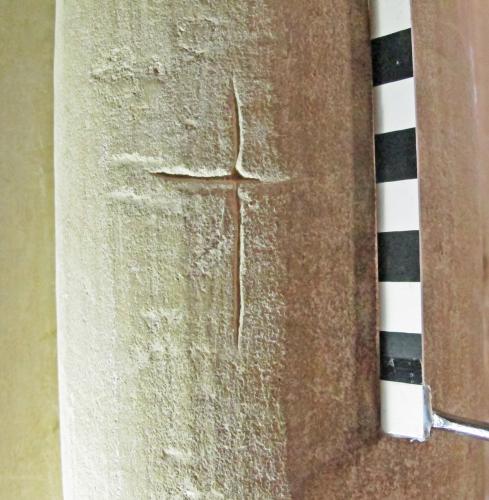 1. Deeply carved cross. North aisle pier.