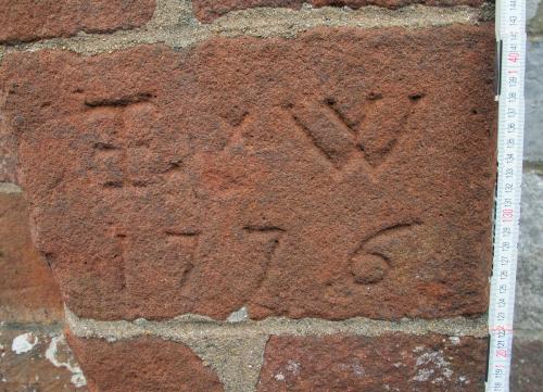 1. I W 1776. Probable initials. Buttress to left of porch.