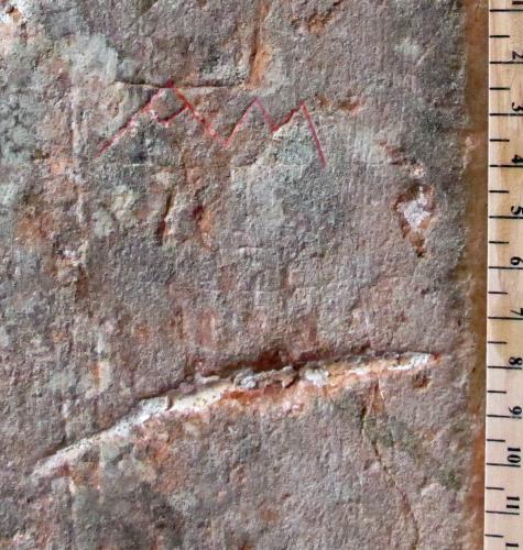 1. Letters A M, highlighted. Relationship with possible frame uncertain. Deep score below. Porch doorway.