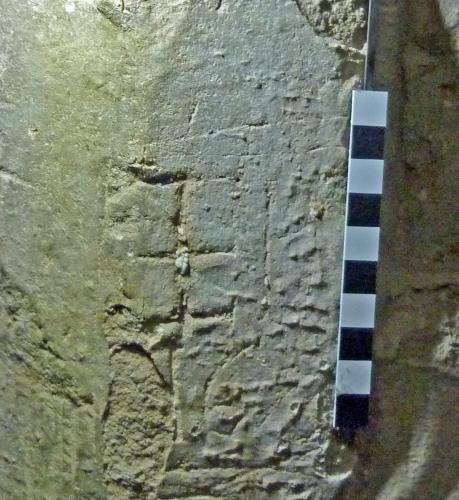 10. Crossed letter I (J). Tower, W. archway.