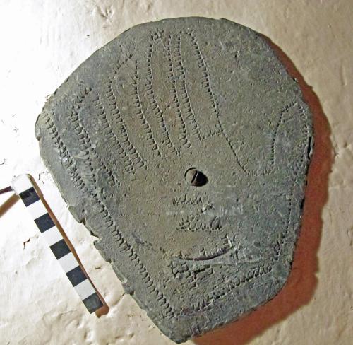 10. Hand outline on lead, made with an unusual tool. 