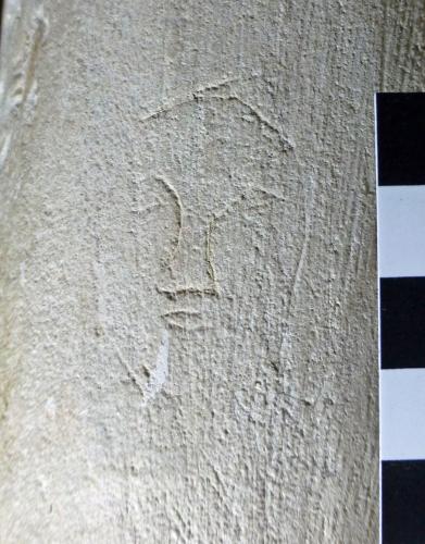 10. Head, with pointed hat.  North aisle pier.