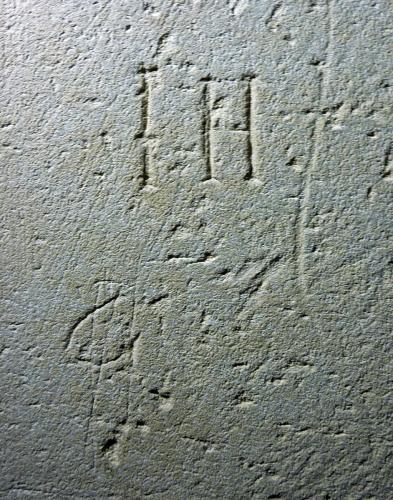 10. Letters I H, possibly a Christogram. Clock chamber.