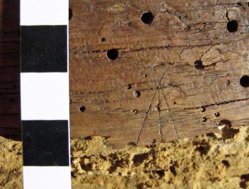 10. Possible arrow type, or M. Bottom lost. Lady Chapel screen.