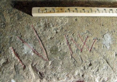 12.  Letters I V & I W. Possibly apotropaic. Lord Dinham effigy.