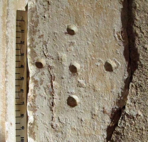 2.  Holes in the form of a cross. South doorway.