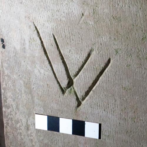 2. W or V V symbol. South doorway.
