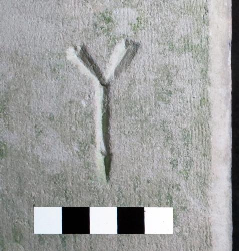 5. Letter Y or symbol. South doorway.