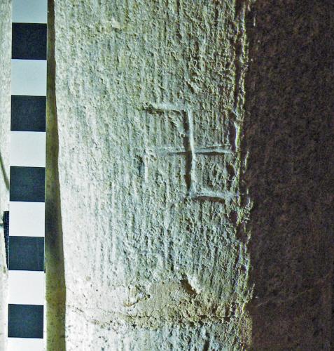 6. Reversed swastika type symbol. North aisle pier.