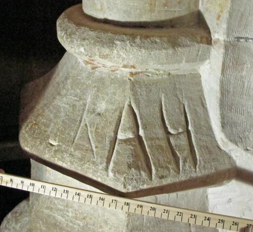 6.  Deeply carved A H, preceded by shallower K. South aisle pier.