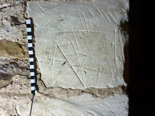 7. Saltire cross or butterfly symbol  & other marks. Clock chamber window.