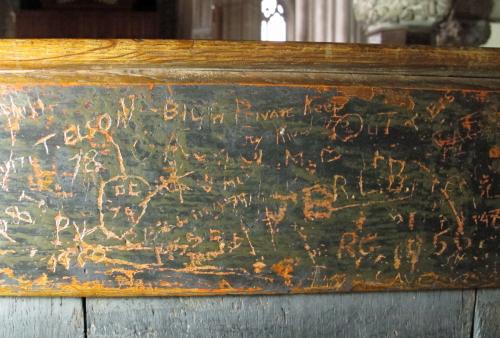 8. Modern graffiti on choir stall.