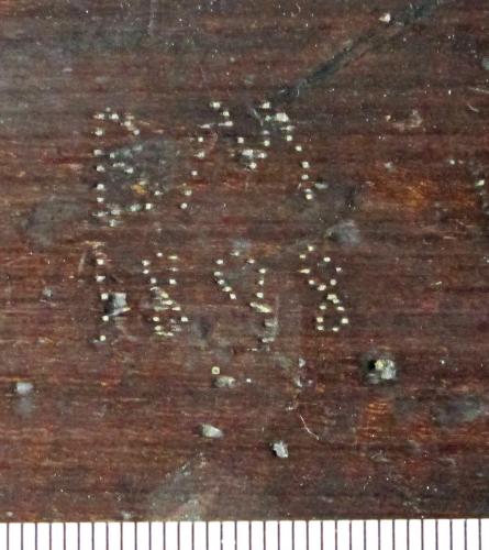 10. Punched initials  B M 1888 or 1898. Choir stall.