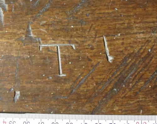 5. Letter T and possible I. Middle aisle bench.