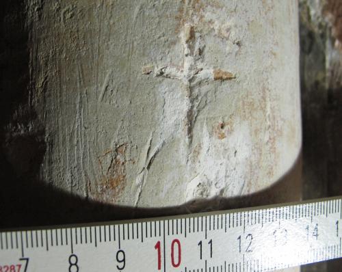 2. Porch, E. side pillar. Deeply carved cross, containing limewash remnants.