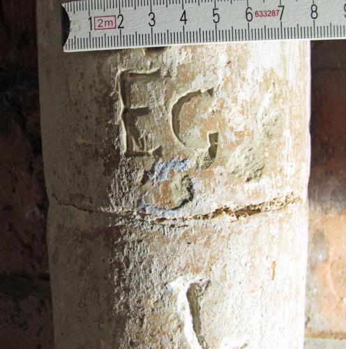 4. Porch, W. side pillar. Probable initials EG, with other letter below.