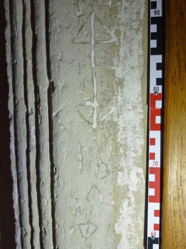 7. South doorway. Double ended arrows (probably apotropaic), and other marks. 