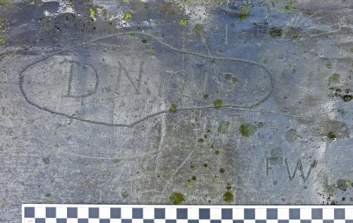 Bondleigh 26. Tower roof. Shoe outline (size about UK 5) with name DN 1910.