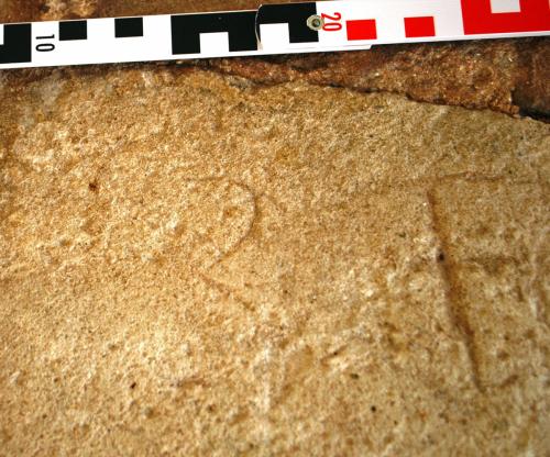 6. Letter B and possible crossed I. Porch, east bench.