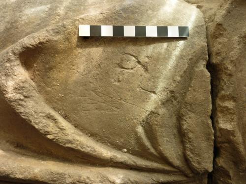 11. Detail of graffiti on the female effigy. Probable initials PL, also overlapping W's or V's on their sides (possible Marian marks). 