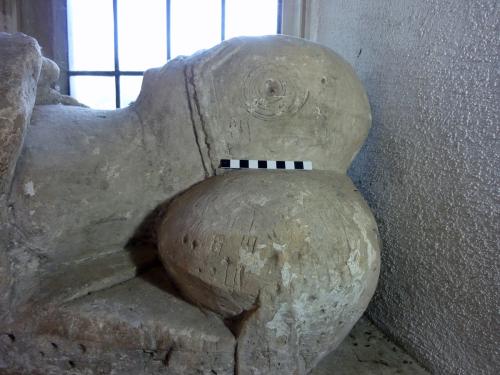 12. Concentric circles, holes & other marks. Male (south) effigy.