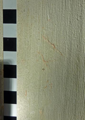 6. Remnants of red paint survive within scored possible lettering. South arcade pier.