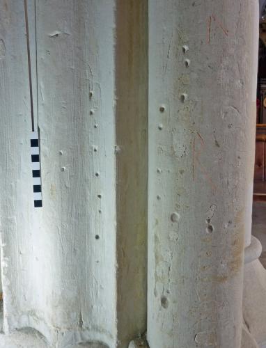 7. Multiple holes, and large letter R (red highlight). South arcade pier.