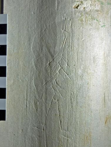 8. Figure, possibly a skeleton, or person holding a shield? South arcade pier.