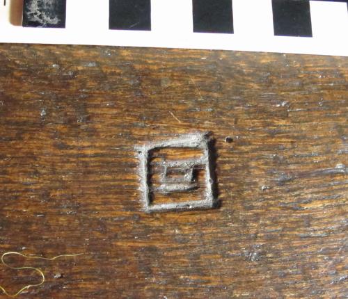 10.  Nave bench. Concentric square or stylised G.